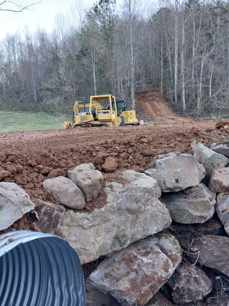 Excavating crew putting in a driveway over a creek in Limestone TN